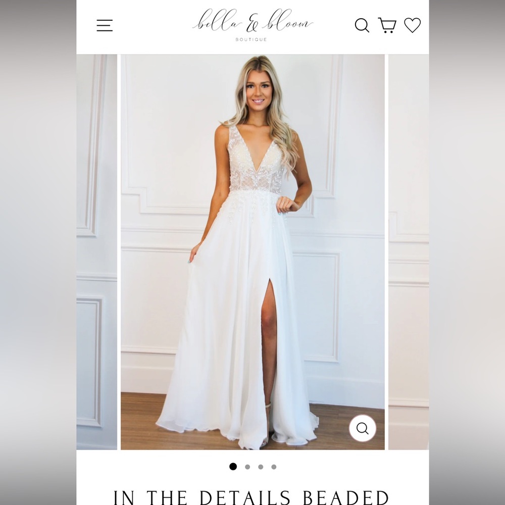 This is a never worn wedding dress, with tags still. Bella & Bloom, size 8.